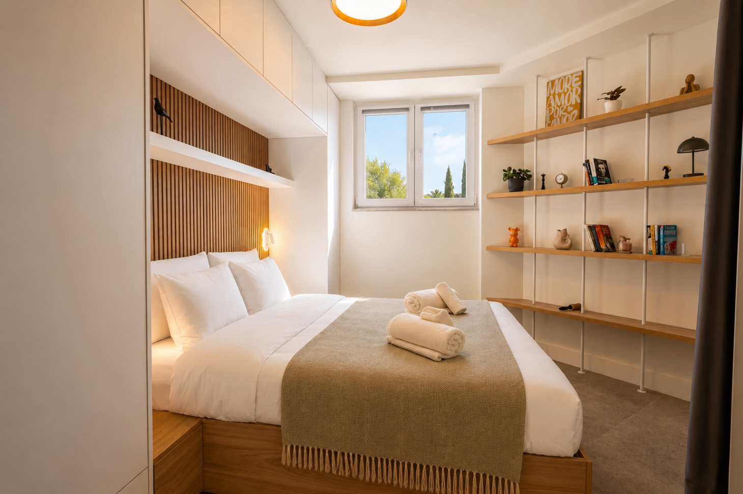 Niriis Suite 3 bedroom with warm wood headboard and open shelving
